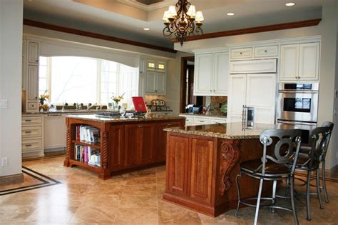 Some concealed modern kitchen designs close up completely so that you'd barely know there was a kitchen there at all. Large kitchen with two islands - Traditional - Kitchen ...
