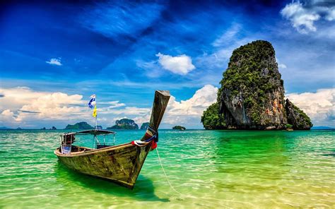 Pranang Beach And Rock Krabi Thailand Long Tail Boat On A Tropical
