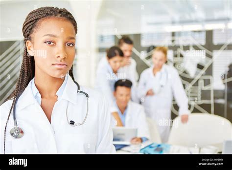 African Woman As Doctor Or Nurse In Medical School Apprenticeship Stock