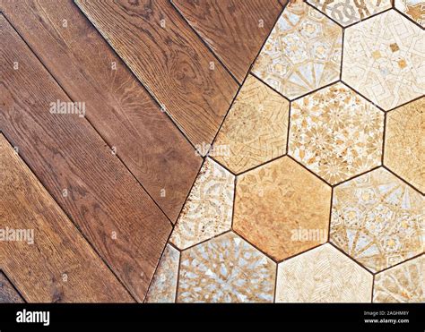 Rustic Floor Tiles And Wooden Planks As Flooring Detail Of A Junction