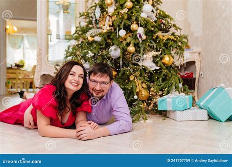 A Happy And Loving Married Couple At The Christmas Tree Stock Image