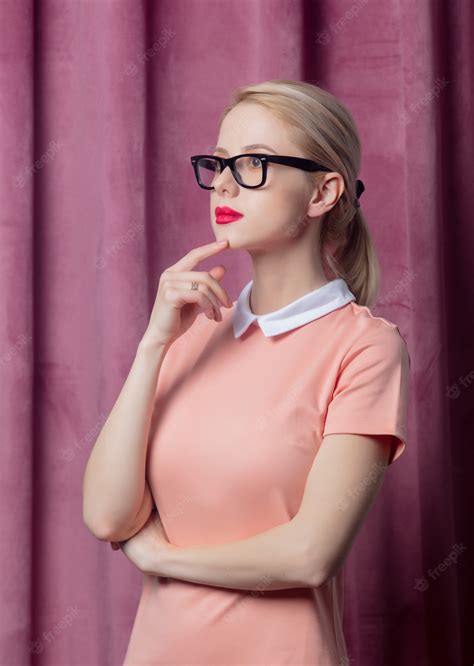Premium Photo Blonde Girl In Glasses And Dress In 70s Style On Suede