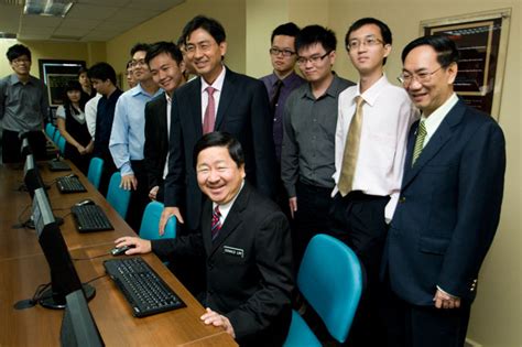 Donald lim siang chai 林祥才. Dato' Lim (sitting) trying out a computer in the lab with ...