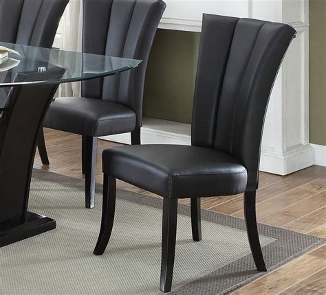 Available in concrete grey, antique brown, olive green, teal, or tan leather, the 'jenson' is ideal for use as a dining chair, or even a comfortable desk chair. Poundex F1591 Black Faux Leather Dining Chair