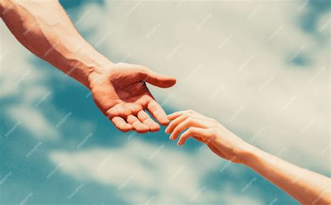 Premium Photo Giving A Helping Hand Lending A Helping Hand Hands Of Man And Woman Reaching