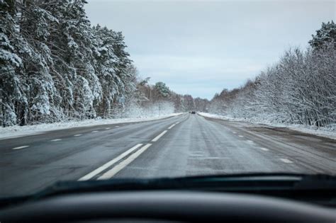 Premium Photo Back View Of Car On Snowy Winter Road