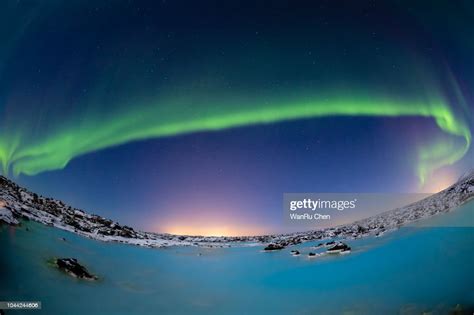 A Beautiful Aurora Dancing Over The Blue Lagoon Iceland High Res Stock
