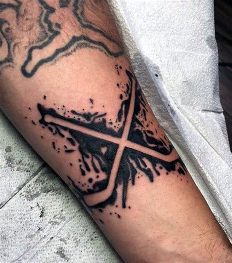 This ice hockey tattoo design is pretty cool with just using the black ink. 75 Hockey Tattoos For Men - NHL Design Ideas
