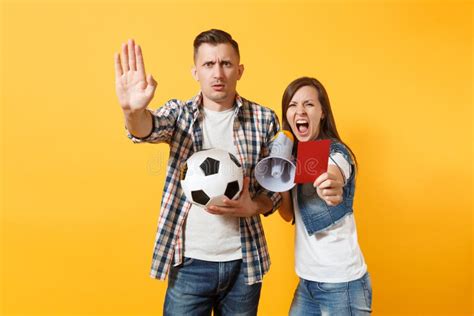 angry fun expessive crazy couple woman man football fans screaming cheer up support team with