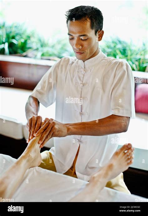 Balinese Male Spa Therapist Giving Foot Refloxology Massage At Ayung Spa Ubud Hanging Gardens
