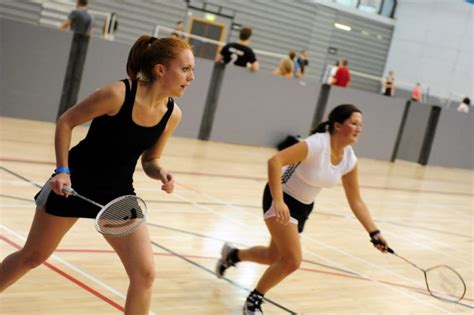 Two Girls Playing Badminton Indoors London Sport