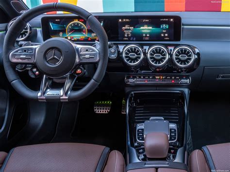 The interior comes with a new sport steering wheel, amg dynamic select controller, new infotainment system with apple car play support, seat cushion depth adjustment and a few color combinations. Mercedes-Benz A45 S AMG 4Matic (2020) - picture 82 of 119