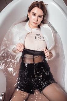 We create hot wetlook photos and video. Wetlook by Completely Wet Girl Dressed in Leather Shorts and Black Tights - Wetfoto.com