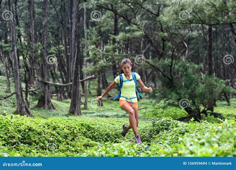 Trail Runner Woman Athlete Running Jumping In Forest Nature Mountains