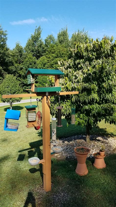 A Bird Feeder In The Shape Of A Tree