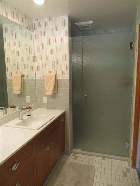 The first rule of thumb in any bathroom remodel for tile is that you need to take everything back down to the original condition they were in after the house was first framed. Lynne's Ice Grey Daltile bathroom remodel - lovely!