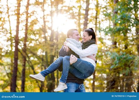 Couple In Love Man Carrying Woman In His Arms Stock Photography