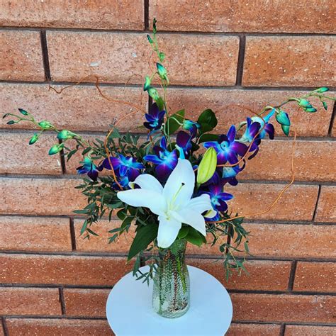 Blue Orchids And Crystal Blanca Lily Vase In San Diego Ca House Of