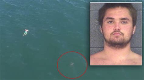 Suspect Fleeing Police Jumps Into Ocean And Swims Dangerously Close To