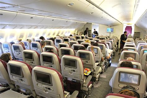 The Economy Class Cabin Of A Qatar Airways Boeing 777 300er Plane A
