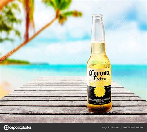 Corona extra is a pale lager produced by mexican brewery cervecería modelo and owned by belgian company ab inbev. Corona extra bierfles - Redactionele stockfoto © venge ...