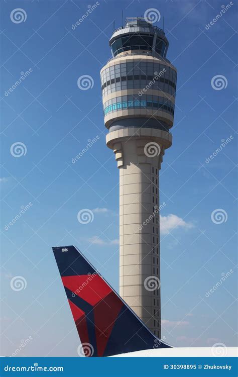 Delta Plane Next To Air Traffic Control Tower At Atlanta Hartsfield