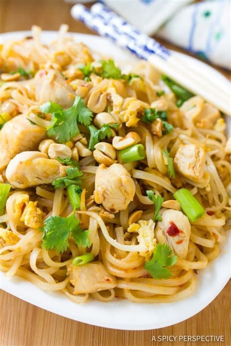 Rice noodles are tossed with chicken, peanuts, garlic and simple homemade sauce for a ridiculously delicious chicken pad thai! Easy Chicken Pad Thai Recipe #ASpicyPerspective | Chicken ...