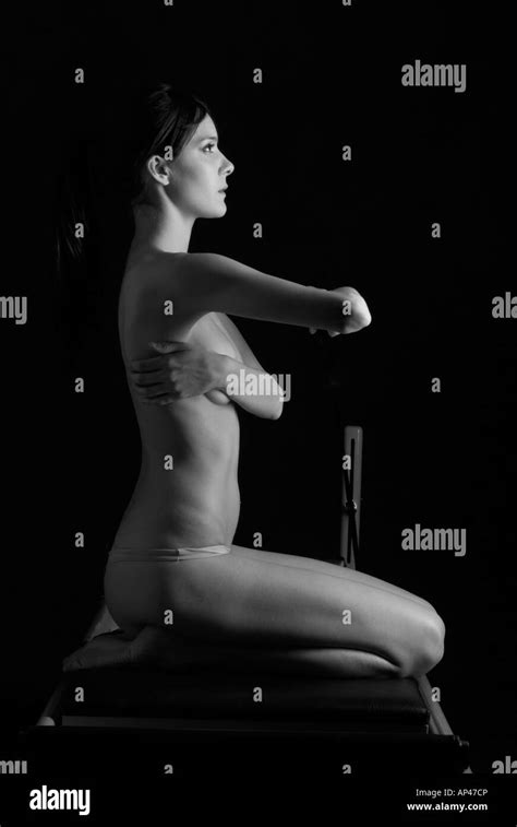Nude Woman Doing Pilates Exercise Kneeling Stock Photo Alamy