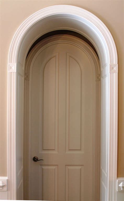 Paneled Arch Opening With Archtop Door