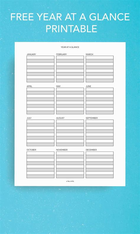 The Free Year At A Glance Printable Is Displayed On A Blue Background