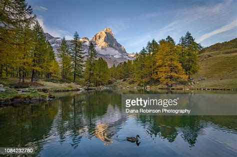 The Matterhorn On The Italian Side At Sunset Reflected In Lake Blue