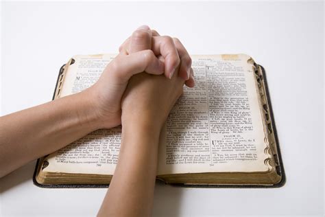 Child Hands Praying Over Open Bible Rich Legg Flickr