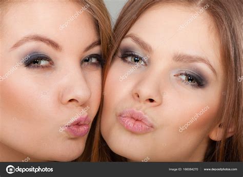 Two Beautiful Women Blonde And Brunette Having Fun Stock Photo By