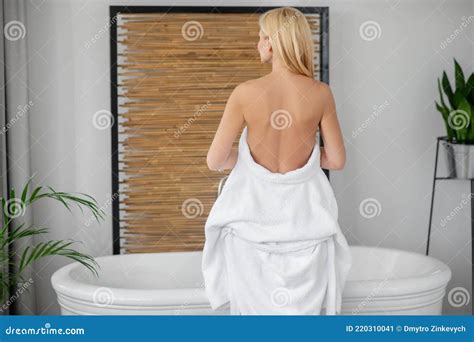 a beautiful woman in a white bath robe showing her naked back stock image image of white