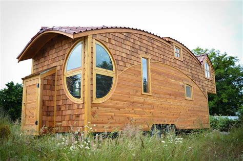 New Tiny House Lives Large With Extra High Ceiling And Fun Curves Off