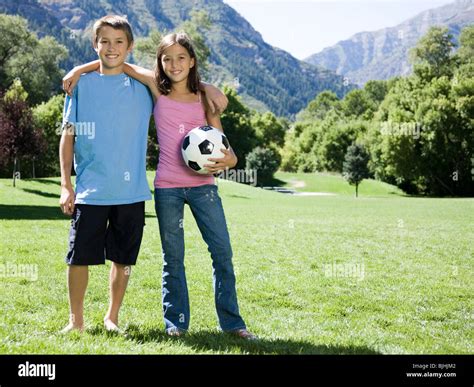 Brother And Sister With A Soccer Ball Stock Photo Alamy