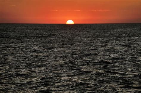 Sunrise Over Black Ocean Sea Rising Sun Red Photograph By David Lyons