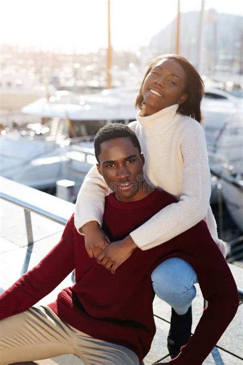 Happy Black Couple Enjoying Time Spending Together While Sitting In