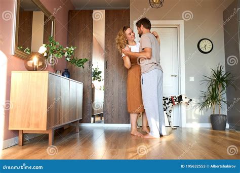 Cute Married Couple In Love Dance In Living Room At Home Stock Image