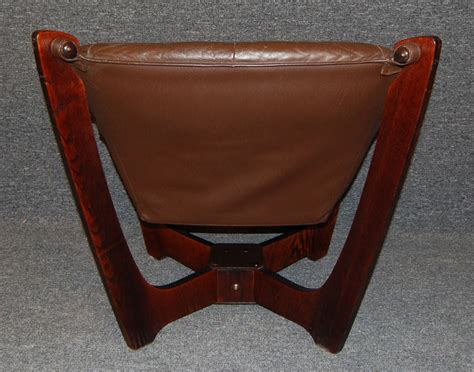 Mid century sculptural barrel chair $750. Set of Four Mid-Century Modern Leather Sling Chairs at 1stdibs