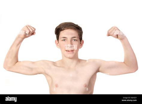 White Teenage Boy Flexing His Muscles Showing Off Stock Photo Royalty