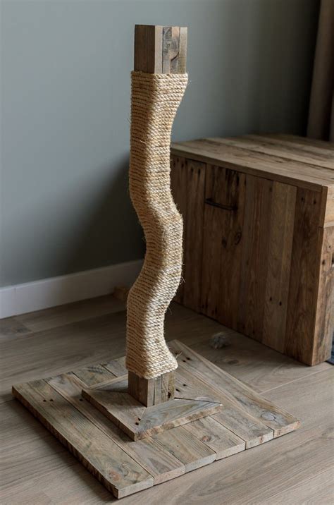 How to train your cat or kitten to use a scratching post. 25 Easy DIY Cat Scratching Post Ideas - Meowlogy