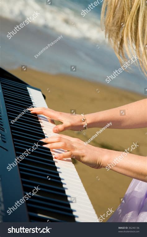 Playing Music At The Seashore Beautiful Female Hands