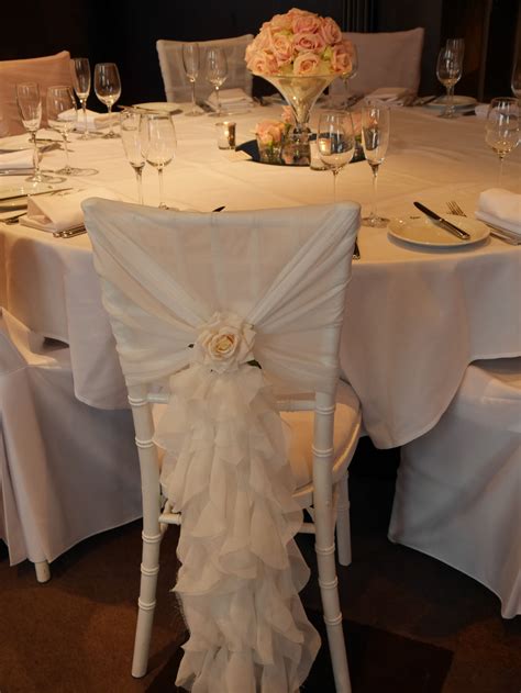 Ivory Chiffon Ruffle Over A White Chiavari Chair Finished With An Ivory