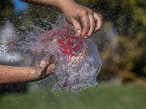 High Speed Photo Of A Water Balloon Bursting Frozen In 8000th Of A