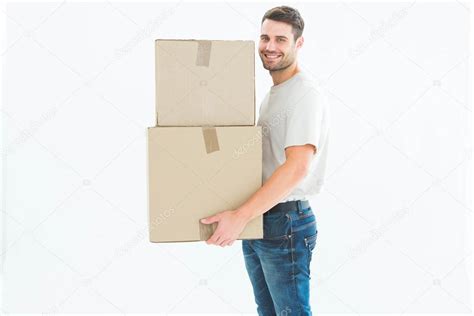Delivery Man Carrying Cardboard Boxes Stock Photo By ©wavebreakmedia