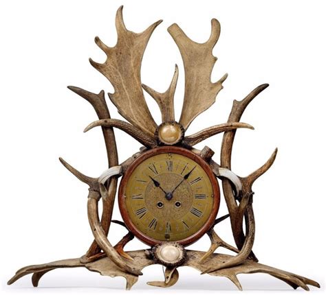 A Hunting Theme Commode Clock With Caribou And Deer Antlers Boars