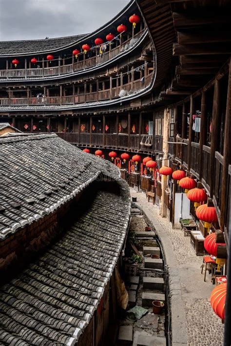 Red Lanterns Suspended From The Walls Of Fujian Tulou Longyan City