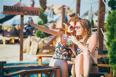 Girls Taking A Selfie At Beach Bar By Stocksy Contributor Lumina Stocksy