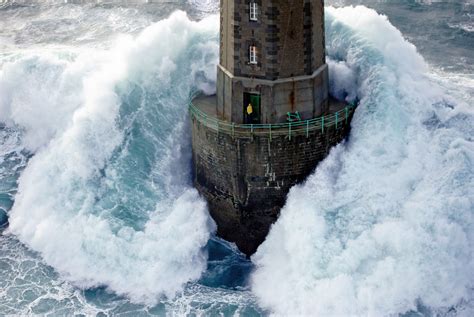 A Huge Wave Hits The La Jument Lighthouse Brittany France By